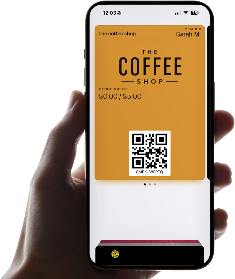 A hand holding an iPhone showing a store credit card in Apple Wallet