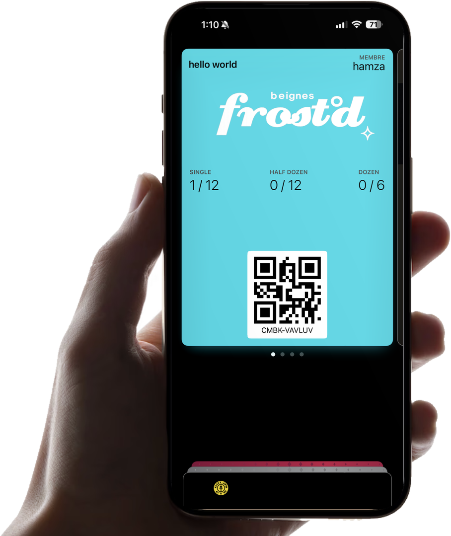 A hand holding an iPhone with a frost'd stamp card in Apple Wallet